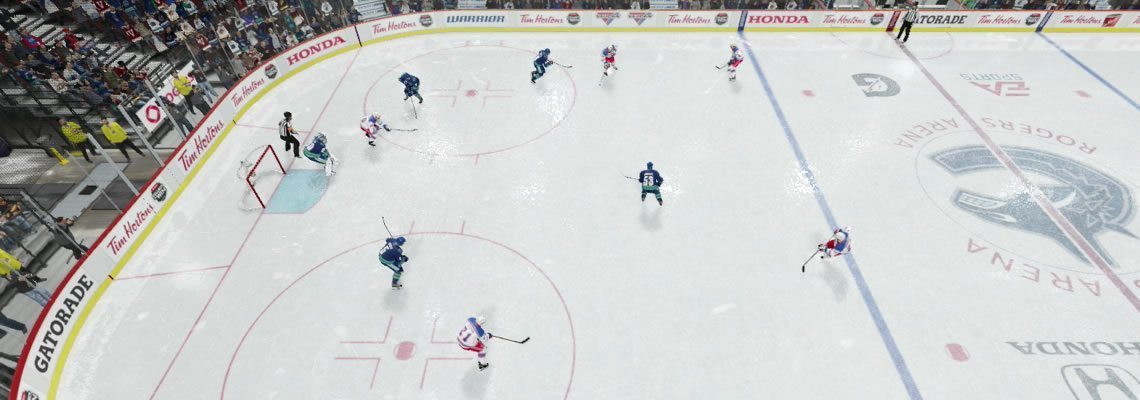 Large Box penalty kill formation with defenders attacking the puck carrier